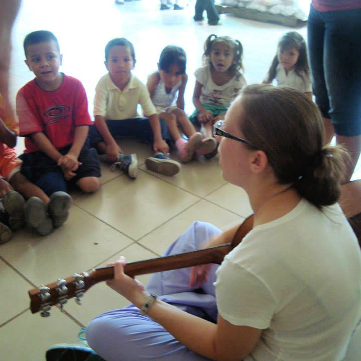 A BRIGHT Children International music therapist leads a music therapy session with a group of young children in Nicaragua.